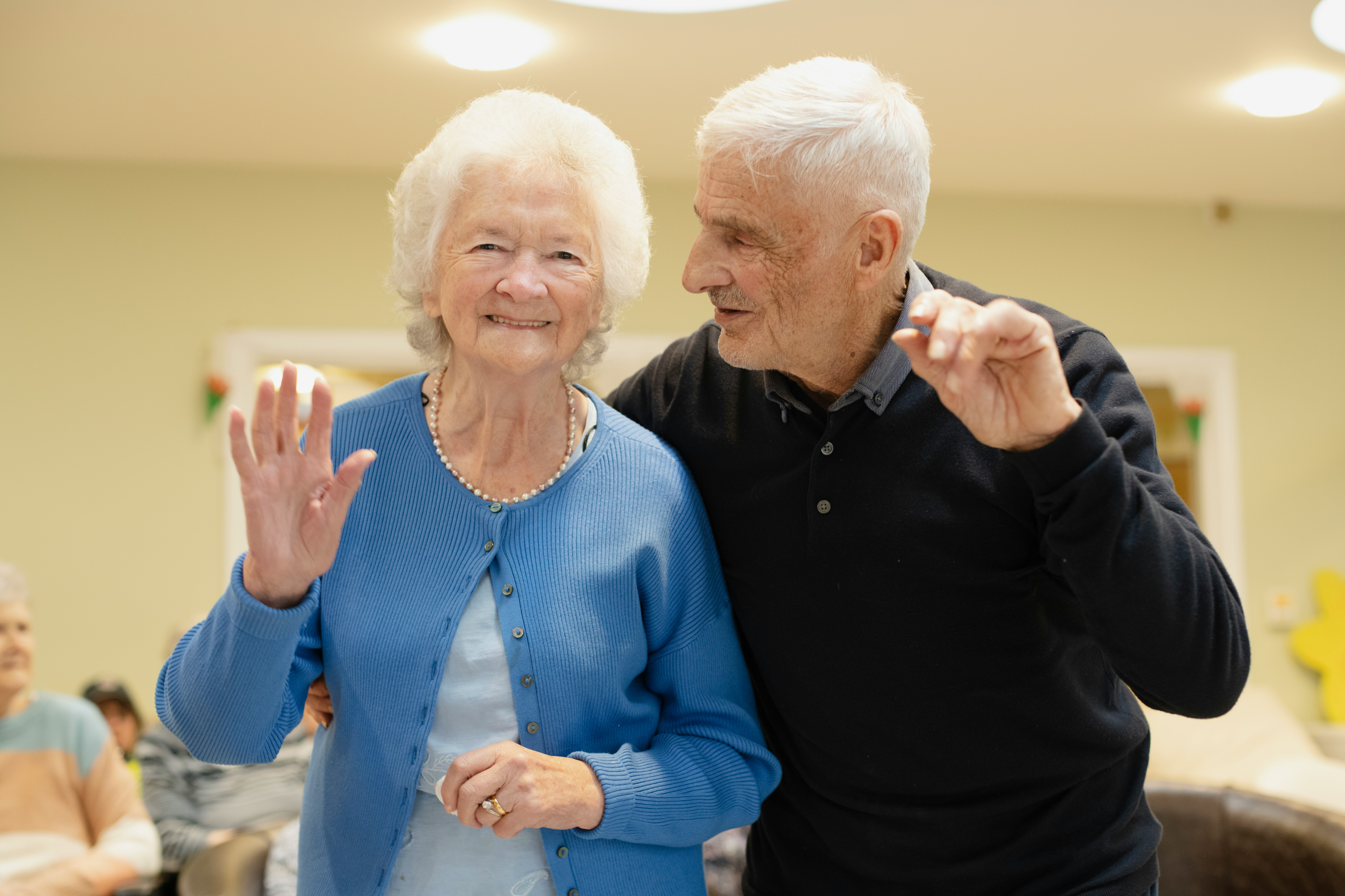 Seniors dancing and laughing together at a community social event in Victoria BC